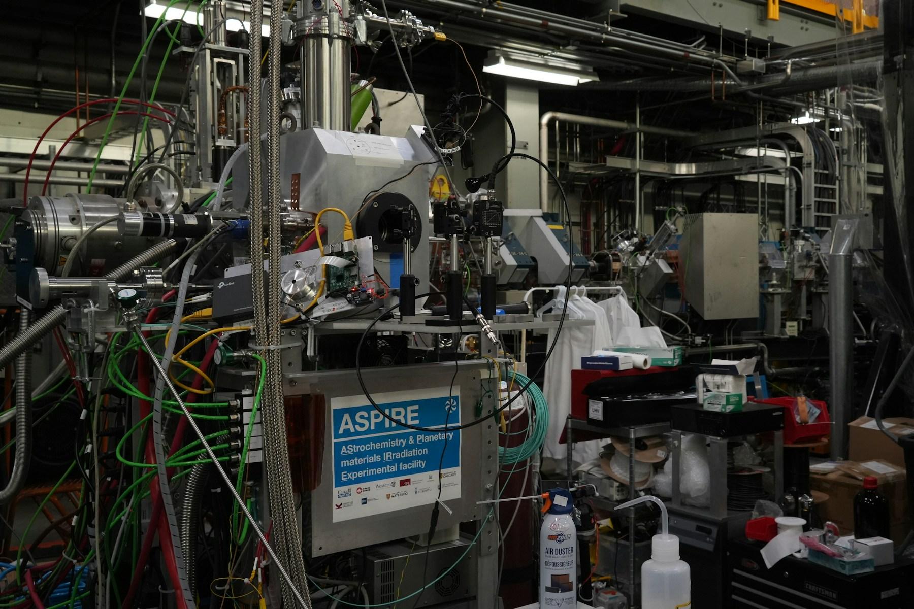 Complex scientific equipment and computers inside a large laboratory