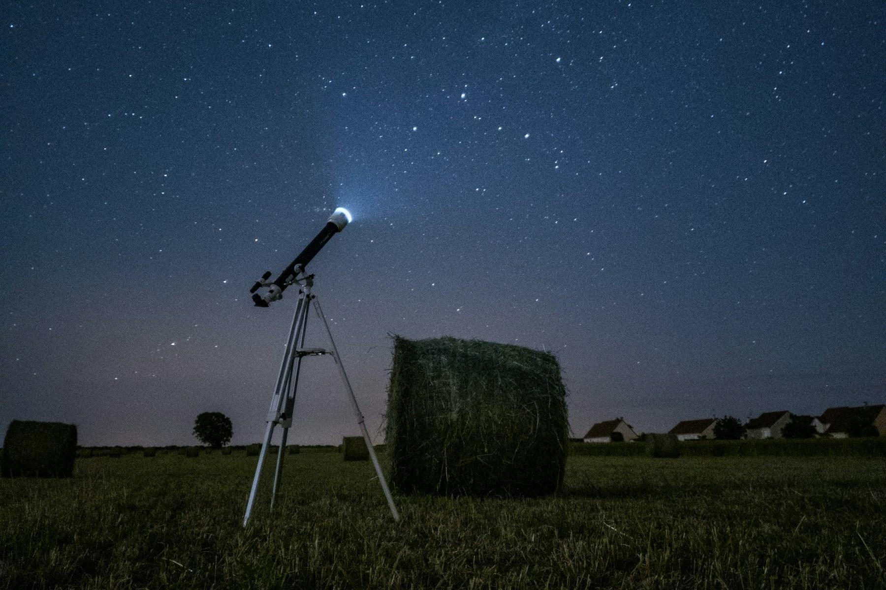 A large radio observatory dish beneath a dark night sky